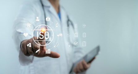 Doctor pointing digital ISO icon with healthcare symbols, representing hospital quality standards,...