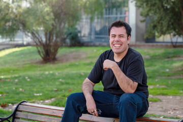 young man sitting on bench