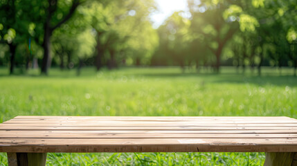 Fototapeta premium A wooden bench sits in a lush green field