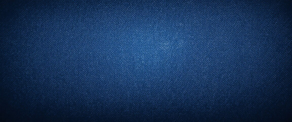 Deep blue denim texture with grunge effect, faded jeans fabric background, perfect for casual fashion, vintage clothing, and textile design