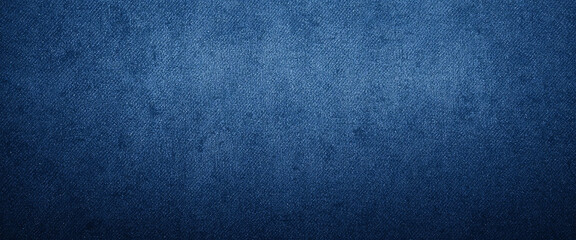 Deep blue denim texture with grunge effect, faded jeans fabric background, perfect for casual fashion, vintage clothing, and textile design