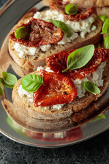 Ciabatta with sun dried tomatoes in olive oil, ricotta and basil.