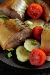 Smoked mackerel with fresh cucumbers, tomatoes and green onion.