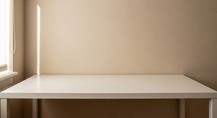 Fototapeta premium Empty white table beneath a beige wall with a vertical beam of light