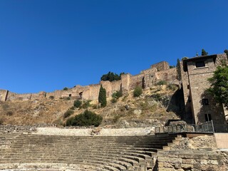 Ancient ruins of Roman theatre below Alcazaba fort in Malaga, Costa del Sol, Andalusia, Spain