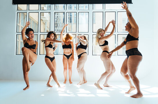 Multiethnic group of women wearing underwear with diverse kind of bodies