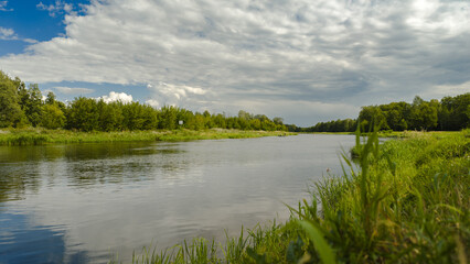 Serene River and Lush Green Landscape in Nowy Lubiel, Poland