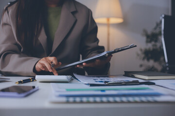Portrait of young Hispanic professional business woman standing in office. Happy female company...