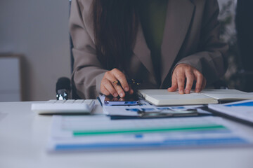 Portrait of young Hispanic professional business woman standing in office. Happy female company...