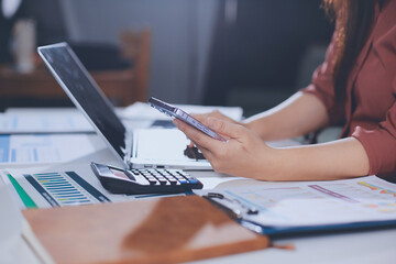 Portrait of young Hispanic professional business woman standing in office. Happy female company...