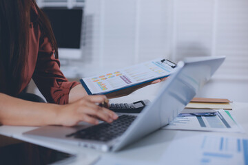 Portrait of young Hispanic professional business woman standing in office. Happy female company...