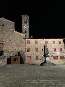 Piazza at Night in Il Mugello &ndash; Picturesque View of the Square in Front of San Gaudenzio Abbey, Softly Lit and Full of Historic Charm in the Heart of Tuscany