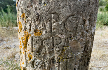 Archaeological Roman milestone marker carved with Latin letters dedicated to Emperor Vespasian