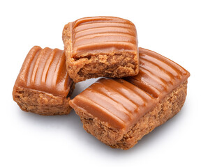Caramel sweets or butterscotch fudge on white background. File contains clipping path.