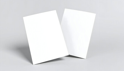 Two blank white vertical paper cards mockup standing on a neutral gray background with subtle shadows.