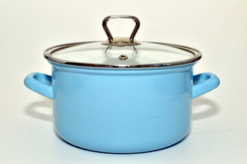 Blue enamel saucepan on a white background.