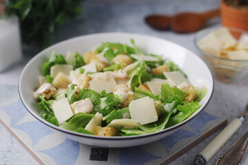 A bowl with classic Caesar salad