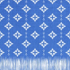White Stitched Diamond Design on Blue Fabric