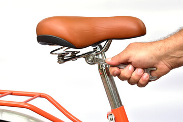Tightening bicycle seat bolts with a metalworking tool.