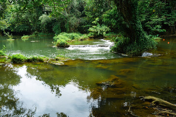 Fototapeta premium Chet Sao Noi Waterfall National Park or Seven Little Girls waterfall, a seven tiers of small and beautiful waterfall in Namtok Chet Sao Noi National Park, Saraburi, Thailand.