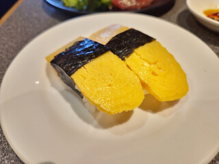 Tamago Nigiri Sushi on a Plate. Close View.