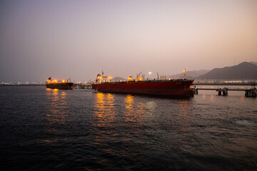 Fototapeta premium cargo ship at sunset