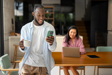 Couple of freelance IT specialists using digital technology devices while working remotely from home