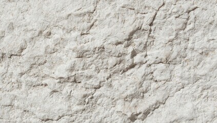 Obraz premium Closeup texture of a rough, cracked, and weathered natural stone surface with detailed patterns and shadows