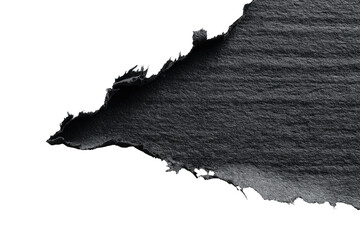 Close-up of a torn piece of dark gray material against a black background.  The edges of the tear show texture and unevenness