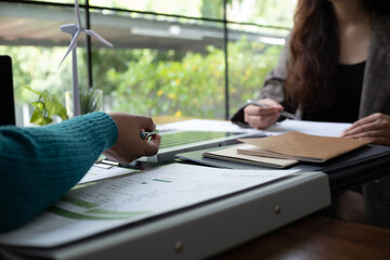 A sales representative presenting solar and wind power, alternative energy, clean energy for future.