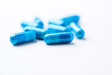 Amino acids capsules on bright background. Soft focus. Close up. Copy space.	