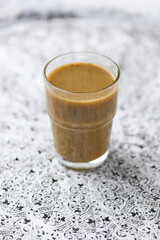 Kale smoothie on bright background. Soft focus. Copy space.	