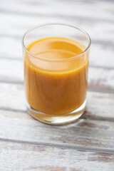 Mango smoothie on bright background. Soft focus. Copy space.	