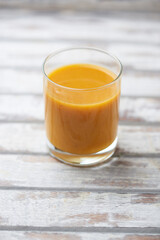 Mango smoothie on bright background. Soft focus. Copy space.	
