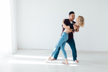Man And Woman Dancing To Music In Room