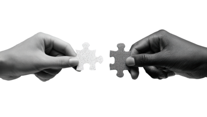 Two hands, one light-skinned and one dark-skinned, hold and connect two puzzle pieces against a black background