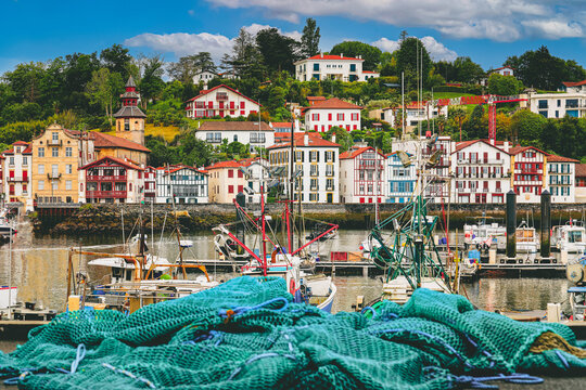 Traditional half-timbered basque houses in port of Saint Jean de Luz, Nouvelle-Aquitaine, France