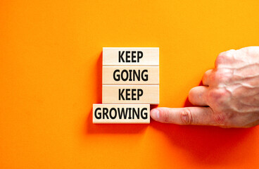 Keep going and growing symbol. Concept words phrase Keep going keep growing on beautiful wooden...