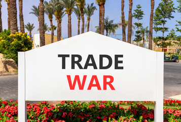Trade war symbol. Concept word Trade war on beautiful white billboard. Beautiful blue sky and palm...