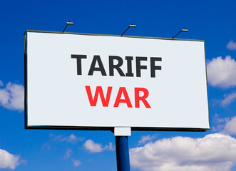 Trade tariff war symbol. Concept word Tariff war on beautiful white billboard. Beautiful blue sky...
