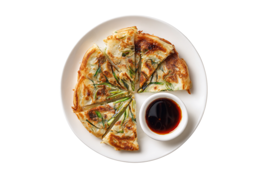 Savory korean scallion pancake with dipping sauce isolated on transparent background
