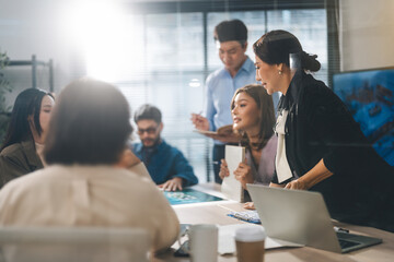 Leader business mature woman asian working together traning team skill positive emotion at modern office