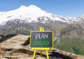 Plan ahead symbol. Concept word Plan ahead on beautiful black blackboard. Beautiful stone mountain...