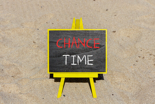 Chance time symbol. Concept word Chance time on beautiful black blackboard. Beautiful sand beach background. Black blackboard. Business chance time concept. Copy space.