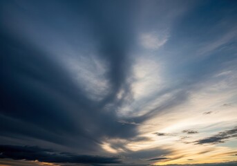 Fototapeta premium Dramatic sky with dark clouds and golden sunset light