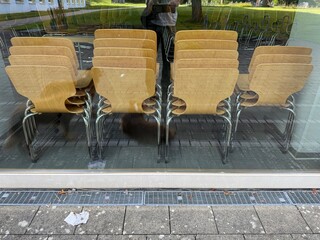 Chic and Stylish Chairs Beautifully Displayed Behind Elegant Glass for Enhanced Aesthetic Appeal
