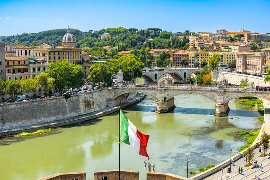 The Tiber River and the Italian flag set against the backdrop of Rome