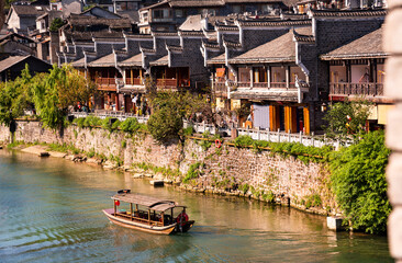 Fenghuang ancient town, China. Traditional chinese wooden houses in old watertown