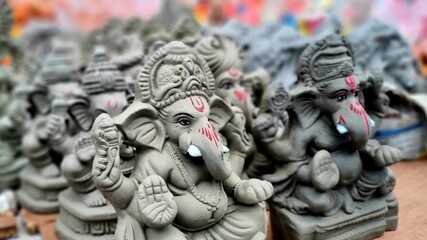 Vinayaka Chavithi and Ganesh Chaturthi festival, a close-up of handmade Lord Ganesha statues,...