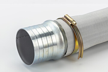 Metal pipe connector with brass strap flexible hose industrial fitting silver color close up...